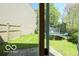 Fenced backyard with green space and a trampoline at 2277 Grand Fir Dr, Greenwood, IN 46143
