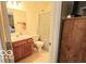 Well-lit bathroom featuring neutral decor, a vanity, and a shower with a patterned curtain at 2277 Grand Fir Dr, Greenwood, IN 46143