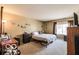 Inviting bedroom featuring neutral decor, a comfortable bed, and a large window for natural light at 2277 Grand Fir Dr, Greenwood, IN 46143