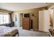Spacious bedroom featuring neutral decor, a large window, and carpeted floors at 2277 Grand Fir Dr, Greenwood, IN 46143