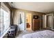 Neutral-toned bedroom with carpet, a window, and en-suite access to a bathroom at 2277 Grand Fir Dr, Greenwood, IN 46143
