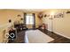 Bright bedroom with wood laminate flooring, a window, and plenty of wall decor at 2277 Grand Fir Dr, Greenwood, IN 46143