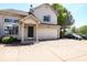 Charming two-story home with a two car garage, front porch, neutral siding, and a well maintained driveway at 2277 Grand Fir Dr, Greenwood, IN 46143
