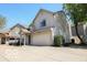 View of a two-story home with beige siding, a two car garage, and a well maintained driveway at 2277 Grand Fir Dr, Greenwood, IN 46143