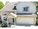 Charming two-story home features an attached two-car garage, inviting entryway, and well-maintained landscaping at 2277 Grand Fir Dr, Greenwood, IN 46143