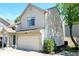 Inviting exterior of a two-story home featuring a garage, neutral siding, and well-maintained landscaping at 2277 Grand Fir Dr, Greenwood, IN 46143