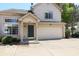Charming two-story home with a two car garage, front porch, neutral siding, and a well maintained driveway at 2277 Grand Fir Dr, Greenwood, IN 46143