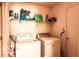 Practical laundry area equipped with washer, dryer, and shelving at 2277 Grand Fir Dr, Greenwood, IN 46143