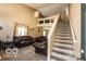 Spacious living room featuring plush seating, high ceilings, and abundant natural light at 2277 Grand Fir Dr, Greenwood, IN 46143