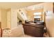 Inviting living room area with leather furniture and natural lighting at 2277 Grand Fir Dr, Greenwood, IN 46143