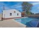 Backyard with in-ground pool with a sunroom and patio furniture, great for outdoor living at 2305 Caldwell Pl, Columbus, IN 47201