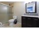 Updated bathroom with glass shower door, modern vanity, and tile flooring at 2305 Caldwell Pl, Columbus, IN 47201