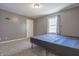 Bedroom features gray walls, carpet flooring, and a window for natural light at 2305 Caldwell Pl, Columbus, IN 47201