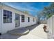 Home exterior with a fenced yard, concrete patio, and a welcoming front door at 2305 Caldwell Pl, Columbus, IN 47201