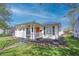 Charming single-story home with a welcoming front porch and beautifully landscaped front yard at 2305 Caldwell Pl, Columbus, IN 47201