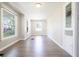 Open hallway featuring light hardwood floors, neutral wall color, and abundant natural light at 2305 Caldwell Pl, Columbus, IN 47201