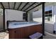 Hot tub on patio with a canopy for shade and privacy, perfect for relaxation at 2305 Caldwell Pl, Columbus, IN 47201