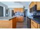 Open kitchen with stainless steel appliances, wood cabinets and a kitchen island at 2305 Caldwell Pl, Columbus, IN 47201