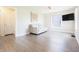 Inviting living room featuring sleek floors, a comfortable couch, and a mounted TV for relaxation at 2305 Caldwell Pl, Columbus, IN 47201