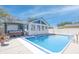 Inviting in-ground pool and sunroom adjacent to a hot tub on an outdoor patio at 2305 Caldwell Pl, Columbus, IN 47201