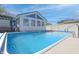 Outdoor pool with adjacent sunroom, perfect for summer fun and relaxation at 2305 Caldwell Pl, Columbus, IN 47201