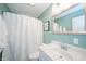 Bathroom featuring a tub with white tile, neutral walls, and a vanity with a sink at 231 N East St, Pendleton, IN 46064