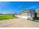 Single-story home with an attached garage and a well-kept driveway at 231 N East St, Pendleton, IN 46064