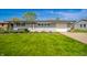 Charming single-story home with a lush green lawn and manicured landscaping at 231 N East St, Pendleton, IN 46064