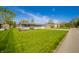 Single-story home with a well-manicured lawn, tidy landscaping, and quiet street at 231 N East St, Pendleton, IN 46064