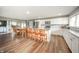 Bright kitchen with white cabinets, stainless appliances, and a large island with seating at 231 N East St, Pendleton, IN 46064