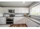 Bright kitchen with stainless steel appliances and countertops at 231 N East St, Pendleton, IN 46064