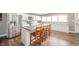 Kitchen with center island and stainless steel fridge at 231 N East St, Pendleton, IN 46064