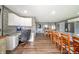 Open concept kitchen with wood floors, a large island, and a built-in desk area at 231 N East St, Pendleton, IN 46064