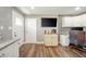 View of office area with desk, cabinets, and TV setup, located off the kitchen at 231 N East St, Pendleton, IN 46064