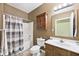 Bathroom with a vanity, mirror, and shower with striped curtain at 2342 Sheek Rd, Greenwood, IN 46143