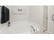Bathroom featuring a soaking tub with modern fixtures, and a frameless glass shower at 2342 Sheek Rd, Greenwood, IN 46143