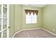 Bright bedroom featuring neutral walls, plush carpet, and a window with decorative curtains and good natural light at 2342 Sheek Rd, Greenwood, IN 46143