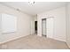 Neutral bedroom with plush carpeting, open closet, and large window at 2342 Sheek Rd, Greenwood, IN 46143