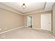 Neutral bedroom with plush carpeting, tray ceiling, and access to an en suite bathroom at 2342 Sheek Rd, Greenwood, IN 46143