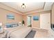 Serene bedroom with neutral tones, comfortable bed, and ample lighting at 2342 Sheek Rd, Greenwood, IN 46143