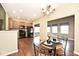 Open concept dining area featuring modern chandelier and access to kitchen at 2342 Sheek Rd, Greenwood, IN 46143