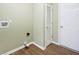 Bright laundry room with wood-look floors, and neutral walls at 2342 Sheek Rd, Greenwood, IN 46143