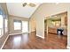 Living area featuring ceiling fan, access to backyard, and kitchen at 2342 Sheek Rd, Greenwood, IN 46143