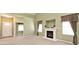 Spacious living room featuring neutral walls, carpet, fireplace, and window treatments at 2342 Sheek Rd, Greenwood, IN 46143