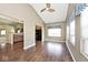 Living area featuring ceiling fan, modern window treatments, and access to kitchen at 2342 Sheek Rd, Greenwood, IN 46143