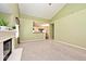 Open concept living room features neutral carpet, fireplace, and a view of dining space at 2342 Sheek Rd, Greenwood, IN 46143