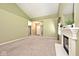 Bright living room featuring neutral walls, carpet, fireplace and front door view at 2342 Sheek Rd, Greenwood, IN 46143