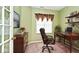 Comfortable office with wood desk, shelving, and complementary decor at 2342 Sheek Rd, Greenwood, IN 46143