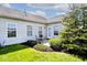 Cozy outdoor patio with space for seating and lovely landscaping including mulch and a mature tree at 2342 Sheek Rd, Greenwood, IN 46143