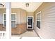 Charming covered porch and front entry featuring neutral siding and brick accents, creating an inviting welcome at 2342 Sheek Rd, Greenwood, IN 46143
